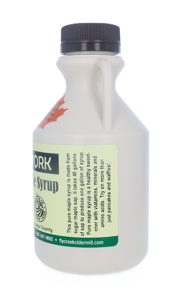 Bottle of syrup with a label on a white background